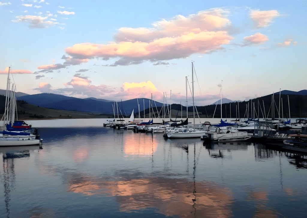 Sailboats docked at serene lake sunset at lake dillon boat rental