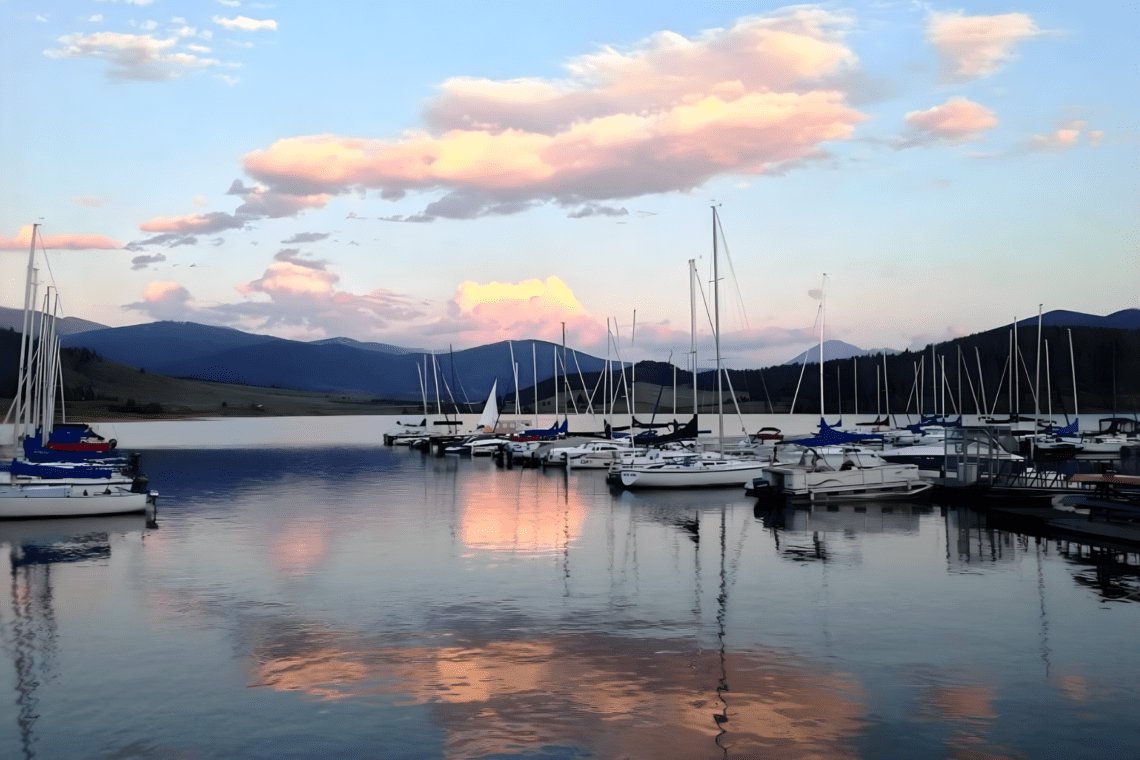 Sailboats docked at serene lake sunset at lake dillon boat rental